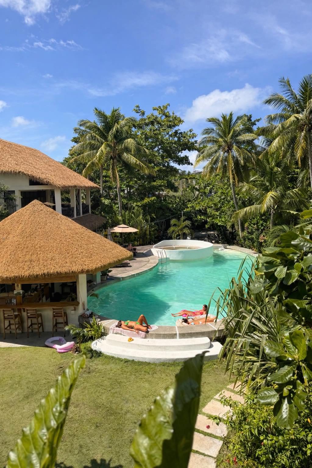 View of the outdoor pool from the Balcony Room at Ohana Resort Siargao