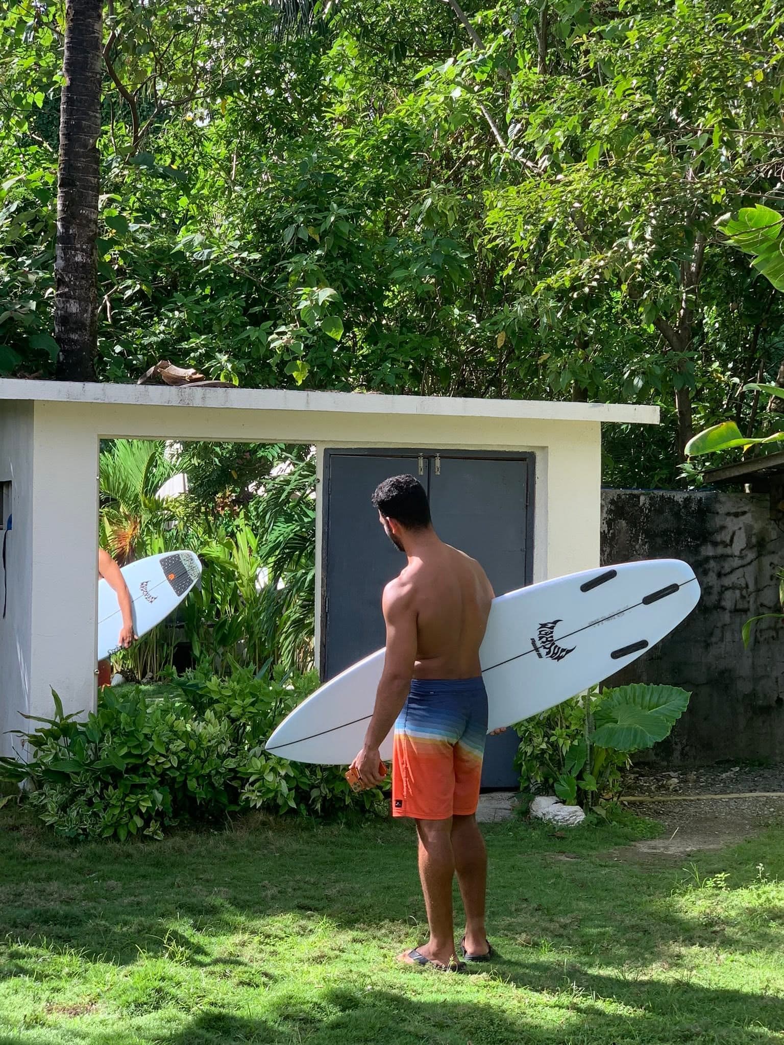 Surfer riding a wave at Cloud 9 near General Luna, a short ride from Ohana Resort Siargao